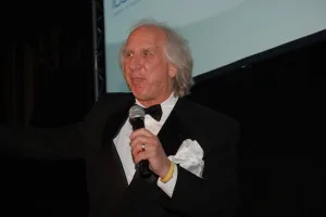 Randy Petersen thanking the team on stage at the 25th Freddie Awards
